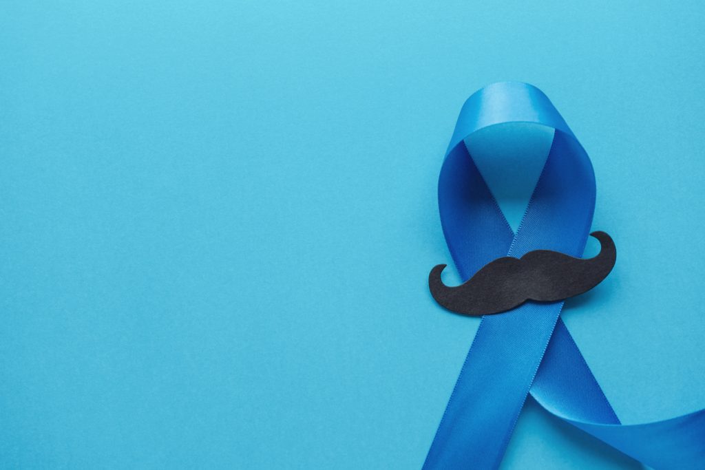 Light blue ribbons with mustache on blue background , Prostate Cancer Awareness, Men health awareness, International Men's Day